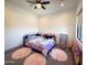 Cozy bedroom with a unicorn-themed bedspread and plenty of floor space at 42434 N Tonto Rd, Cave Creek, AZ 85331