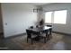 Bright dining room featuring a large window and modern light fixture at 42434 N Tonto Rd, Cave Creek, AZ 85331