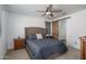 Bedroom with a rustic sliding barn door and ensuite bathroom at 44968 W Norris Rd, Maricopa, AZ 85139