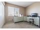 Well-lit bedroom featuring a desk and drawers with a window view, perfect for an office space at 4615 W Boston St, Chandler, AZ 85226