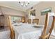 Formal dining room table set with china and glassware, wood chairs and carpet, perfect for meals and conversation at 4615 W Boston St, Chandler, AZ 85226