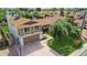 Two-story home features a large driveway, an attached garage, manicured lawn, and desert landscaping at 4615 W Boston St, Chandler, AZ 85226