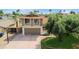 Two-story home featuring an attached garage, well-maintained lawn, and mature tree in a quiet neighborhood at 4615 W Boston St, Chandler, AZ 85226