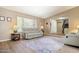 Comfortable living room with a large window, laminate flooring, a neutral color scheme, and recessed lighting at 4615 W Boston St, Chandler, AZ 85226