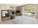 Cozy living room features a brick fireplace, sliding glass doors to backyard, and stylish laminate flooring at 4615 W Boston St, Chandler, AZ 85226