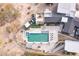 Aerial shot showcases a stunning property with a pool, spa, rooftop patio, and desert landscaping at 5826 E Indian Bend Rd, Paradise Valley, AZ 85253