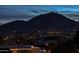 Scenic aerial nighttime view showcases city lights and dramatic mountain backdrop at 5826 E Indian Bend Rd, Paradise Valley, AZ 85253