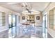 Dining area with large windows and stylish lighting fixture at 5826 E Indian Bend Rd, Paradise Valley, AZ 85253