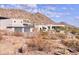Contemporary home with desert landscaping and a mountain backdrop, blending modern design with natural beauty at 5826 E Indian Bend Rd, Paradise Valley, AZ 85253