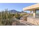 Balcony view of desert landscape with rock accents, natural vegetation, and mountain backdrop at 5826 E Indian Bend Rd, Paradise Valley, AZ 85253