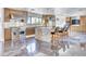 Spacious kitchen featuring custom wood cabinets, stainless steel appliances, and an island with granite countertops at 5826 E Indian Bend Rd, Paradise Valley, AZ 85253