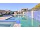 Large outdoor swimming pool with cascading water feature and mountain views at 5826 E Indian Bend Rd, Paradise Valley, AZ 85253