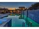 Relaxing pool and backyard oasis with modern design and tranquil waterfall features at 5826 E Indian Bend Rd, Paradise Valley, AZ 85253