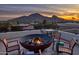 Relax on this rooftop patio with a fire pit, mountain views, and an outdoor seating area perfect for entertaining at 5826 E Indian Bend Rd, Paradise Valley, AZ 85253