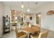 Bright dining area with wood table and chairs, view of kitchen at 5929 S Del Rancho --, Mesa, AZ 85212