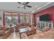 Spacious living room with leather couches and a rustic media cabinet at 6399 W Saratoga Way, Florence, AZ 85132