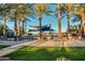 Relaxing poolside patio with shade structures and comfortable seating at 6399 W Saratoga Way, Florence, AZ 85132