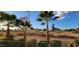 Landscaped backyard with golf course view at 6535 E Superstition Springs Blvd # 124, Mesa, AZ 85206