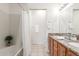 Clean bathroom with granite countertops, double sinks, and a shower/tub combo at 6535 E Superstition Springs Blvd # 124, Mesa, AZ 85206