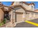 Building exterior showing garage and walkway at 6535 E Superstition Springs Blvd # 124, Mesa, AZ 85206