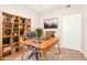 Bright home office featuring built-in shelving and a large desk at 6535 E Superstition Springs Blvd # 124, Mesa, AZ 85206
