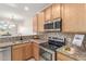 Kitchen with granite countertops and stainless steel appliances at 6535 E Superstition Springs Blvd # 124, Mesa, AZ 85206