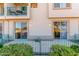 Private patio with a metal fence and lovely landscaping at 6535 E Superstition Springs Blvd # 124, Mesa, AZ 85206