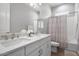 Clean bathroom with double vanity and a tub shower combo at 6607 E Libby St, Phoenix, AZ 85054