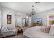 Bright bedroom with a comfortable bed and en-suite bathroom access at 6607 E Libby St, Phoenix, AZ 85054