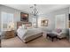 Spacious primary bedroom with plush bed and sitting area at 6607 E Libby St, Phoenix, AZ 85054