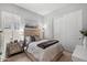 Cozy guest bedroom with a double bed and mirrored dresser at 6607 E Libby St, Phoenix, AZ 85054
