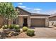 Beautiful one-story home with stone accents and landscaped yard at 6607 E Libby St, Phoenix, AZ 85054