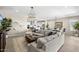 Open living space with sectional sofa, fireplace, and dining area at 6607 E Libby St, Phoenix, AZ 85054