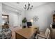 Spacious home office with large desk and access to entryway at 6607 E Libby St, Phoenix, AZ 85054
