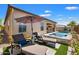 Spacious backyard oasis with a refreshing pool and lounge chairs at 6607 E Libby St, Phoenix, AZ 85054