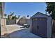 Backyard with a shed, concrete patio, and block wall at 811 W Northern Ave, Phoenix, AZ 85021