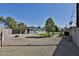 A sprawling backyard featuring a pool, pergola covered patio, and ample space for outdoor activities and entertaining at 811 W Northern Ave, Phoenix, AZ 85021