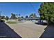 Spacious backyard features artificial turf, pool, outdoor kitchen and a pergola covered dining area, perfect for entertaining at 811 W Northern Ave, Phoenix, AZ 85021