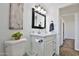 Charming bathroom with white cabinets, a stylish mirror, and modern fixtures at 811 W Northern Ave, Phoenix, AZ 85021