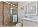 Bathroom featuring glass shower and vanity sink at 811 W Northern Ave, Phoenix, AZ 85021