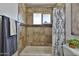 Bathroom with tiled walls, tub, and shower curtain at 811 W Northern Ave, Phoenix, AZ 85021