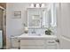 Bathroom with white vanity, sink, mirror and lighting at 811 W Northern Ave, Phoenix, AZ 85021