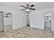 Bedroom features tiled floors and a ceiling fan at 811 W Northern Ave, Phoenix, AZ 85021