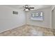 Bedroom with tiled floor, ceiling fan, and a window at 811 W Northern Ave, Phoenix, AZ 85021