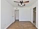 Neutral bedroom with a ceiling fan, wood-look floors, and a closet at 811 W Northern Ave, Phoenix, AZ 85021