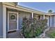 Charming front porch of the house with mature landscaping and a secured front door at 811 W Northern Ave, Phoenix, AZ 85021