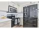 Beautiful kitchen with stainless steel appliances and quartz countertops, perfect for cooking and entertaining at 811 W Northern Ave, Phoenix, AZ 85021