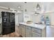 Kitchen featuring a central island, stainless appliances and wood-look flooring and adjacent breakfast area at 811 W Northern Ave, Phoenix, AZ 85021