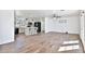 Spacious living room open to the kitchen, with wood-look tile flooring throughout at 811 W Northern Ave, Phoenix, AZ 85021