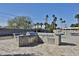 Outdoor kitchen with stainless steel grill and stone surround in a spacious backyard, perfect for entertaining guests at 811 W Northern Ave, Phoenix, AZ 85021